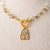Jennifer’s Czech Glass Golden Cross necklace