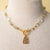 Jennifer’s Czech Glass Golden Cross necklace