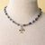 Jennifer’s Sodalite and opalite glass cross necklace