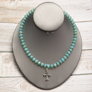 Jennifer’s Aqua Czech Glass Cross Necklace
