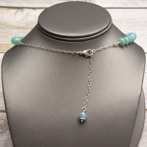 Jennifer’s Aqua Czech Glass Cross Necklace