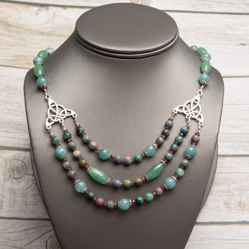 Jennifer’s Jade and Ruby in Kyanite Trinity Knot Necklace