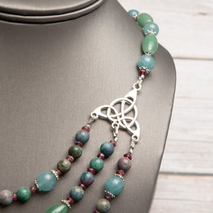 Jennifer’s Jade and Ruby in Kyanite Trinity Knot Necklace