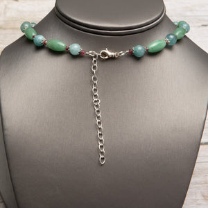 Jennifer’s Jade and Ruby in Kyanite Trinity Knot Necklace