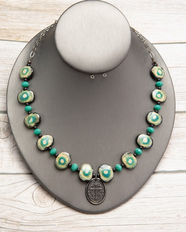 Jennifer’s Teal Ceramic Cross Necklace