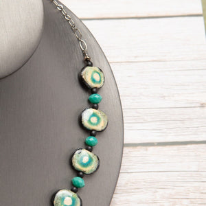 Jennifer’s Teal Ceramic Cross Necklace
