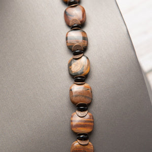 Jennifer’s Tiger Iron Copper Cross Necklace