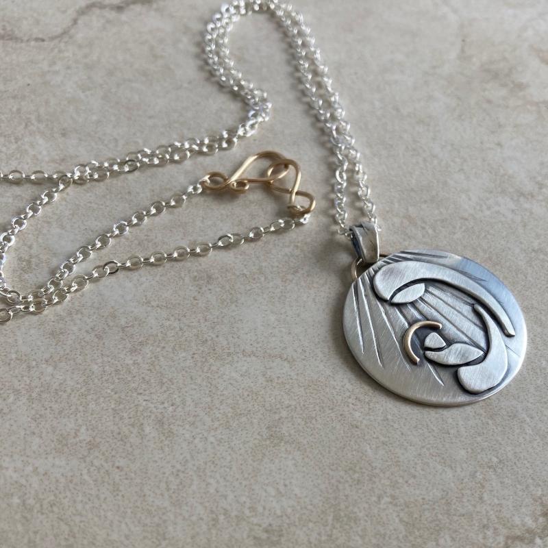 Kathy’s Handcrafted Baby Jesus and Mary Necklace