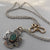 Kathy's Handcrafted Mixed Metal Cross Necklace with Roman Glass