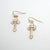 Kelly's Gold Tone Enameled Cross Earrings